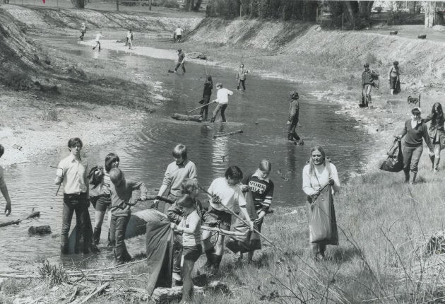 Teenagers sweep the filthy, stinking west branch of Toronto's Don River for garbage in 1971.