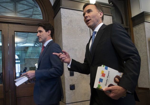 Prime Minister Justin Trudeau and Finance Minister Bill Morneau speak as they walk to the House of Commons in Ottawa, Tuesday March 19, 2019.