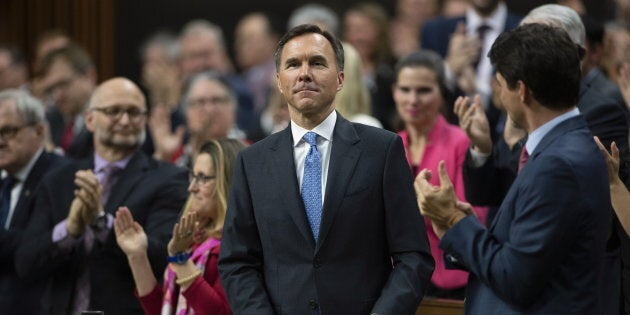 Prime Minister Justin Trudeau and MPs applaud as Finance Minister William Morneau rises to deliver the federal budget in the House of Commons in Ottawa on March 19, 2019.