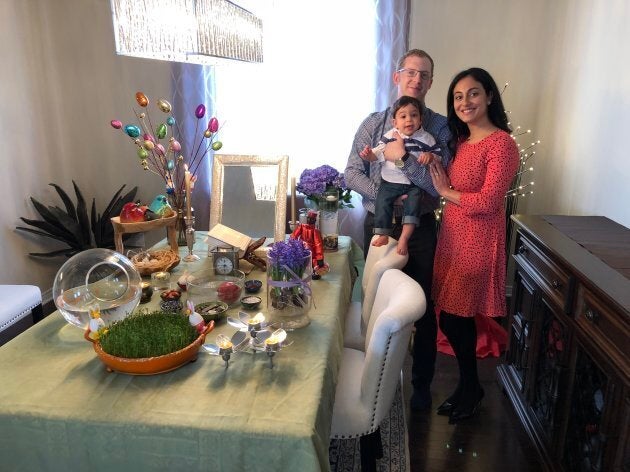 From left to right Christopher Millward and Leily Shafaee with their son at Noorwuz celebrations last year.