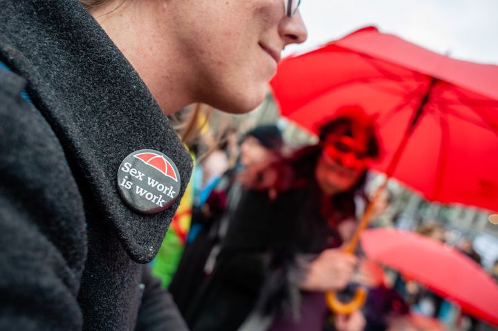 An International Women's Day march participant wears a "Sex work is real work" pin, in this undated photo.