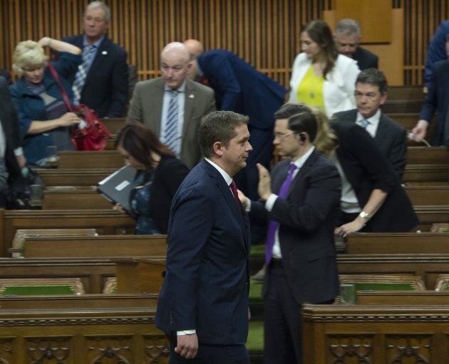 Conservative leader Andrew Scheer leads members of his party out of the House of Commons during the delivery of the federal budget on Tuesday, March 19, 2019 in Ottawa.