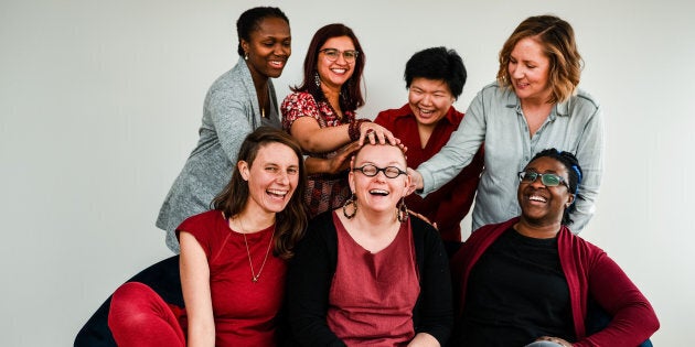 Calgary's Red Community Midwives, from left to right: Maryam Gjerde, Annegret Ebermann, Luisa Franco, Erin Laing (center, with hands on her head), Nancy Tsao, Lindsay Vanderburg, and Babil Pobee.