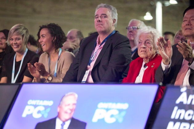 Dean French, centre, chief of staff to Ontario Premier Doug Ford, listens to the premier speak at the Progressive Conservative party convention in Toronto on Nov. 16, 2018.