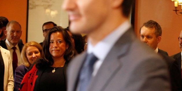 Jody Wilson-Raybould watches Prime Minister Justin Trudeau arrive at Rideau Hall of a cabinet shuffle on Jan. 14, 2019.