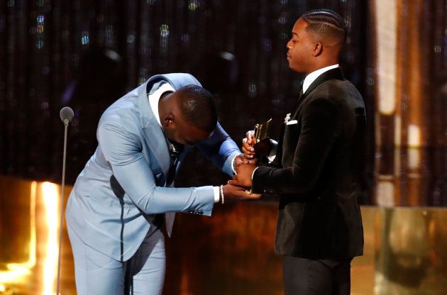 Shamier Anderson presents the Radius Award to his brother Stephan James at the 7th annual Canadian Screen Awards in Toronto on Sunday.
