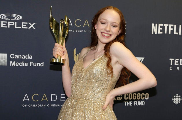 Amybeth McNulty, of "Anne With An E," poses with the award for Best Lead Actress in a Drama Series, backstage.