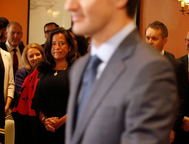 Newly appointed Canadian Veterans Affairs Minister Jody Wilson-Raybould watches Prime Minister Justin Trudeau arrive as he shuffles his cabinet after the surprise resignation of Treasury Board President Scott Brison, in Ottawa, Ontario, Canada, January 14, 2019. Picture taken January 14, 2019. REUTERS/Patrick Doyle