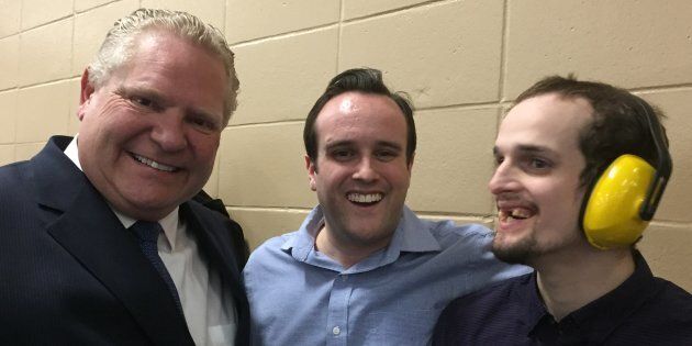 Ontario Premier Doug Ford poses for a photo with Ottawa-West-Nepean MPP Jeremy Roberts and his brother Dillon Roberts.