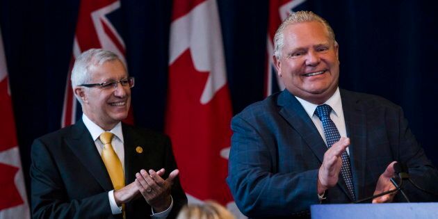 Ontario Finance Minister Vic Fedeli applauds alongside Premier Doug Ford in Toronto on Sept. 24, 2018.