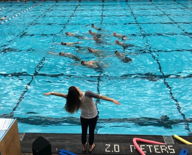 Head coach Holly Hjartarson works with the men's synchronized swimming team in Winnipeg.