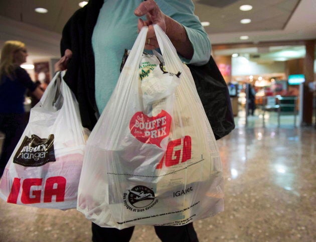 A woman leaves a grocery store in Montreal, on May 15, 2015.