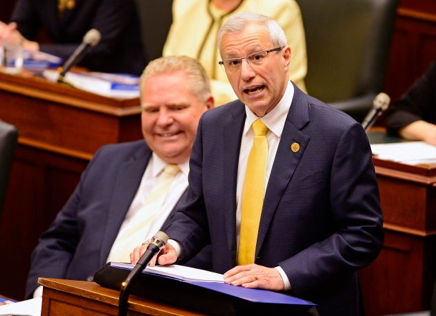 Ontario Finance Minister Vic Fedeli presents the 2019 budget as Premier Doug Ford looks on at the legislature in Toronto on April 11, 2019.