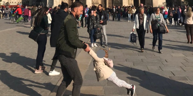 Brooke Windsor took this photo outside Notre Dame just an hour before it was engulfed by fire. Now she wants to find the man and child.