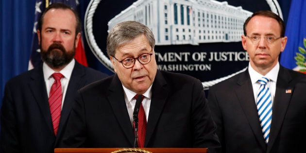 U.S. Attorney General William Barr speaks alongside Deputy Attorney General Rod Rosenstein, right, and Deputy Attorney General Ed O'Callaghan, left, about the release of a redacted version of special counsel Robert Mueller's report during a news conference on April 18, 2019, in Washington, D.C.