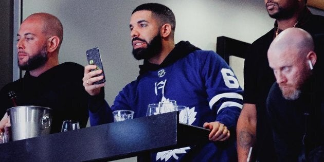 Drake appears to be realizing he's cursed while he attends a playoff game between Toronto Maple Leafs and Boston Bruins on Wednesday night.