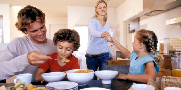 Family eating breakfast in the kitchen