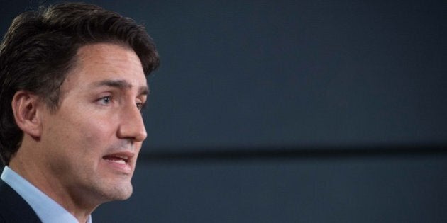 Canadian Liberal Party leader Justin Trudeau speaks at a press conference in Ottawa on October 20, 2015 after winning the general elections. Liberal leader Justin Trudeau reached out to Canada's traditional allies after winning a landslide election mandate to change tack on global warming and return to the multilateralism sometimes shunned by his predecessor. AFP PHOTO/NICHOLAS KAMM (Photo credit should read NICHOLAS KAMM/AFP/Getty Images)