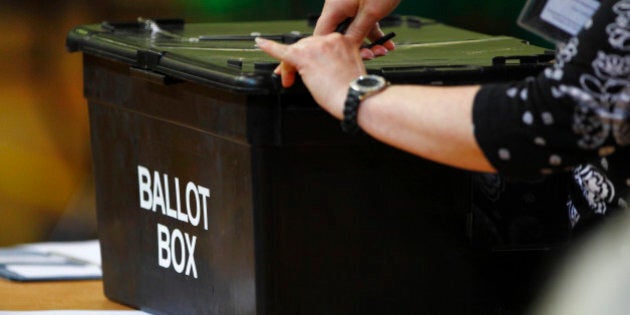 File photo dated 28/02/13 of a ballot box being opened, as a parliamentary committee has said that the Government should bring forward legislation to allow some prisoners to vote to keep in line with human rights laws.