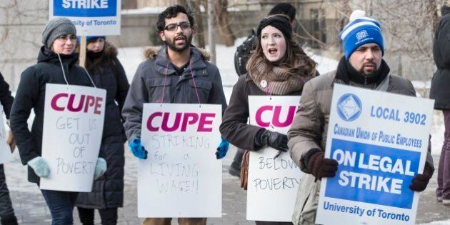 TORONTO, ON - MARCH 2: Picketers from CUPE 3092, representing teaching assistants, began their strike in front of gate to campus on King's College Rd. and College Street. (Bernard Weil/Toronto Star via Getty Images)