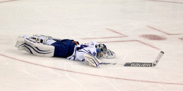 Toronto Maple Leafs goalie James Reimer lies on the ice after New Jersey Devils right wing Jaromir Jagr, of the Czech Republic, scored during the third period of an NHL hockey game, Friday, Feb. 6, 2015, in Newark, N.J. The Devils won 4-1. (AP Photo/Julio Cortez)