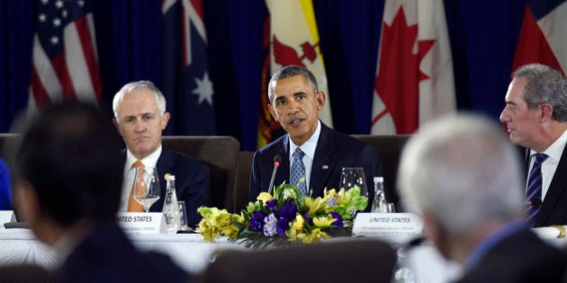 President Barack Obama, center, sitting next to Australiaâs Prime Minister Malcolm Turnbull, left, and U.S. Trade Representative Michael Froman, right, speaks during a meeting with other leaders of the Trans-Pacific Partnership countries in Manila, Philippines, Wednesday, Nov. 18, 2015, ahead of the start of the Asia-Pacific Economic Cooperation (APEC) summit. (AP Photo/Susan Walsh)