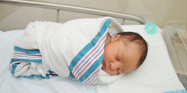 Wrapping newborn in blanket new arrivals