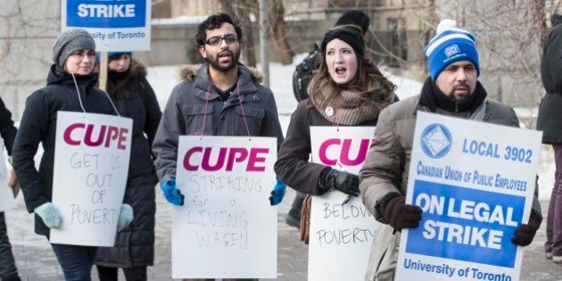 TORONTO, ON - MARCH 2: Picketers from CUPE 3092, representing teaching assistants, began their strike in front of gate to campus on King's College Rd. and College Street. (Bernard Weil/Toronto Star via Getty Images)