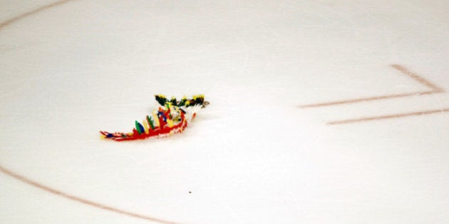 CHICAGO - MAY 24: An idian headress lies on the ice after the Detroit Red Wings won 6-1 against the Chicago Blackhawks during Game Four of the Western Conference Championship Round of the 2009 Stanley Cup Playoffs on May 24, 2009 at the United Center in Chicago, Illinois. (Photo by Jim Prisching/Getty Images)