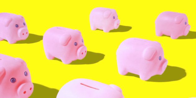 Pink piggy banks on yellow background (Digital Composite)