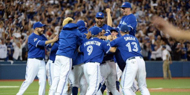 TORONTO, CANADA - OCTOBER 14: The Toronto Blue Jays celebrate after winning Game 5 of the ALDS against the Texas Rangers at the Rogers Centre on Wednesday, October 14, 2015 in Toronto, Canada. (Photo by Jon Blacker/MLB Photos via Getty Images)