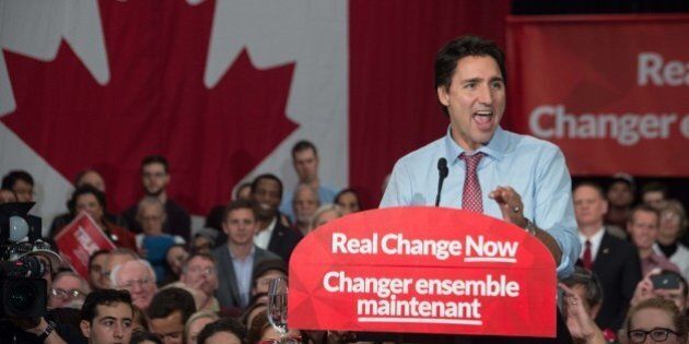 Canadian Liberal Party leader Justin Trudeau speaks at a victory rally in Ottawa on October 20, 2015 after winning the general elections. Liberal leader Justin Trudeau reached out to Canada's traditional allies after winning a landslide election mandate to change tack on global warming and return to the multilateralism sometimes shunned by his predecessor. AFP PHOTO/ NICHOLAS KAMM (Photo credit should read NICHOLAS KAMM/AFP/Getty Images)