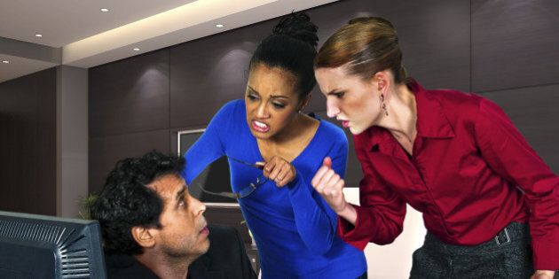businesswomen taking out anger on guy at the office