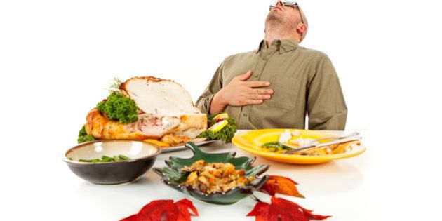 Isolated on white man with a Thanksgiving dinner roasted turkey.