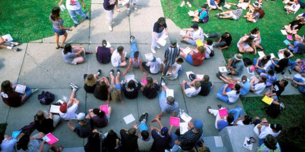 Students And Faculty Outdoors.