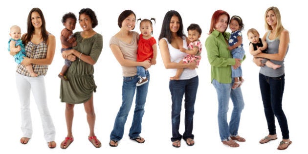 Six multi-ethnic mothers standing in a line while holding their babies. Mothers in order: Ecuadorian/White, Chinese/African American, Korean, Indian, Hispanic, White