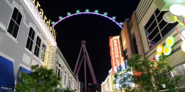 LAS VEGAS, NV - MARCH 30: A general view of people at The LINQ with the Las Vegas High Roller in the background on March 30, 2014 in Las Vegas, Nevada. The 550-foot-tall attraction is the highest observation wheel in the world and features 28 spherical cabins that can hold up to 40 people each. (Photo by Ethan Miller/Getty Images)