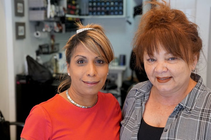 Luz Hernandez with her niece, Noemi Quinones, who was the first of Hernandez’s relatives to ask for help. Quinones has been living in Hernandez’s living room since December and going to work in the salon.