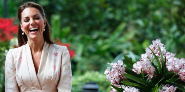 Kate, Duchess of Cambridge, smiles during a ceremony naming a hybrid orchid in their honor at the Orchid Garden within the Singapore Botanical Gardens in Singapore, Tuesday, Sept. 11, 2012. The Duke and Duchess of Cambridge are on an official three-day trip to Singapore. (AP Photo/Stephen Morrison, Pool)