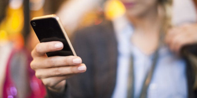 Woman taking selfie with smartphone