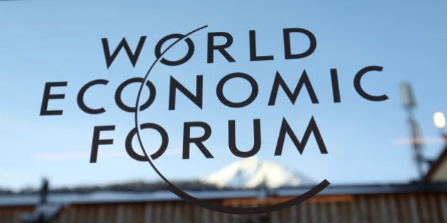 A logo sits on a glass panel inside the Kongress Zentrum, also known as Congress Center, the venue of the World Economic Forum (WEF) in Davos, Switzerland, on Monday, Jan. 19, 2015. This week World leaders, influential executives, bankers and policy makers will attend the 45th annual meeting of the World Economic Forum in Davos that runs from Jan. 21-24. Photographer: Chris Ratcliffe/Bloomberg via Getty Images