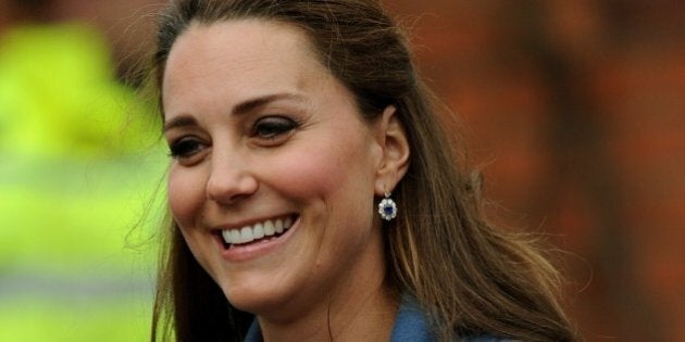 Britain's Kate, Duchess of Cambridge during a visit to Emma Bridgewater factory in Stoke on Trent, England, to see production of a mug,Wednesday Feb. 18 2015. Emma Bridgewater factory has launched a mug to be sold in support of East Anglia's Children's Hospices. (AP Photo/Rui Vieira)