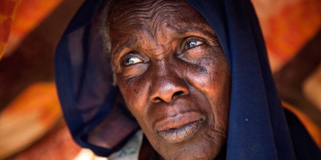 DARFUR, SUDAN - MARCH 10: A Sudanese woman in refugee camps as South Sudanese fled to Kalma and Al Salam camps refugee camp due to the clashes live under difficult life conditions in Darfur's south Um Gunya and Hajeer area, Sudan, on March 9, 2014. According to African Union-United Nations Hybrid operation in Darfur (UNAMID), the number of refugees raised recently almost 20.000 people. (Photo by Albert Gonzalez Farran-UNAMID/Anadolu Agency/Getty Images)