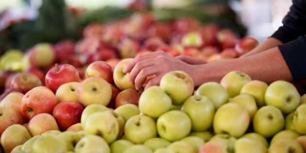 Apples and other healthful choices are on display at a Sunday morning farmers market in Arlington, Va., Oct. 5, 2014. (AP Photo/J. Scott Applewhite)