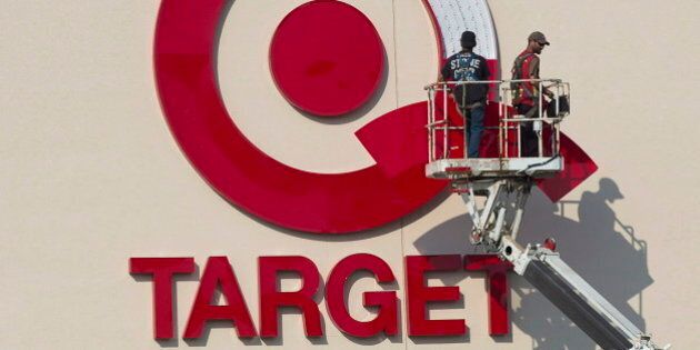 Workers install an outdoor sign at the new Target store at the Mic Mac Mall in Dartmouth, N.S. on July 20, 2013. Target says it will discontinue operating stores in Canada. It currently has 133 locations and 17,600 employees across the country.THE CANADIAN PRESS/Andrew Vaughan
