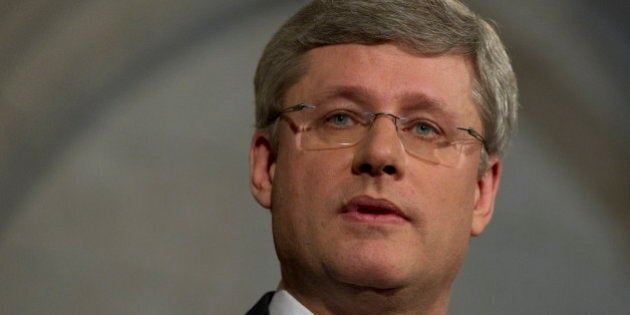 Prime Minister Stephen Harper speaks with the media outside the House of Commons on Parliament Hill in Ottawa, Canada on Wednesday March 23, 2011. Canada's three opposition parties said Wednesday they planned to topple the conservative government in a vote of no confidence in Parliament this week and trigger the country's fourth election in seven years. Prime Minister Stephen Harper needs the support of at least one opposition party to stay in power, but all three rejected Harper's proposed budget after it was announced Tuesday. (AP Photo/The Canadian Press, Sean Kilpatrick)