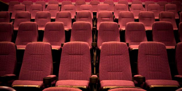 Empty chairs in movie theater.