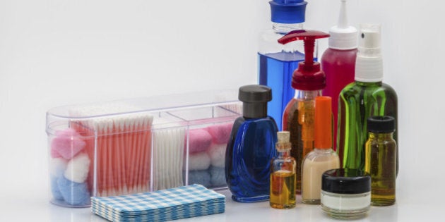 A Colourful group of Lotions and Creams together with Cleaning Wipes, Earbuds, and Cotton Wool.