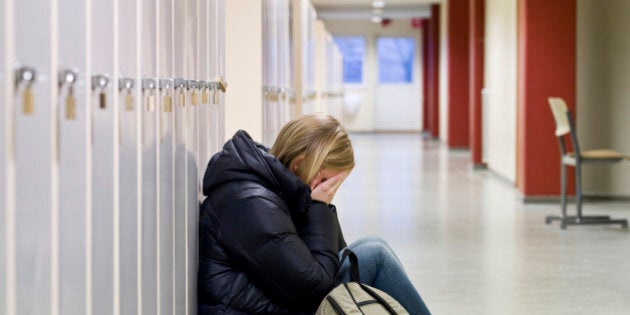 Young woman getting bullied at school