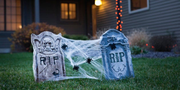 USA, Illinois, Metamora, Halloween gravestone decoration on lawn